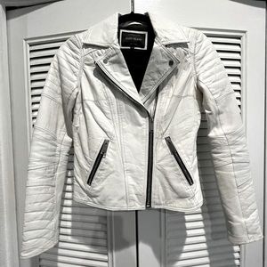 White leather jacket with black zip detail
